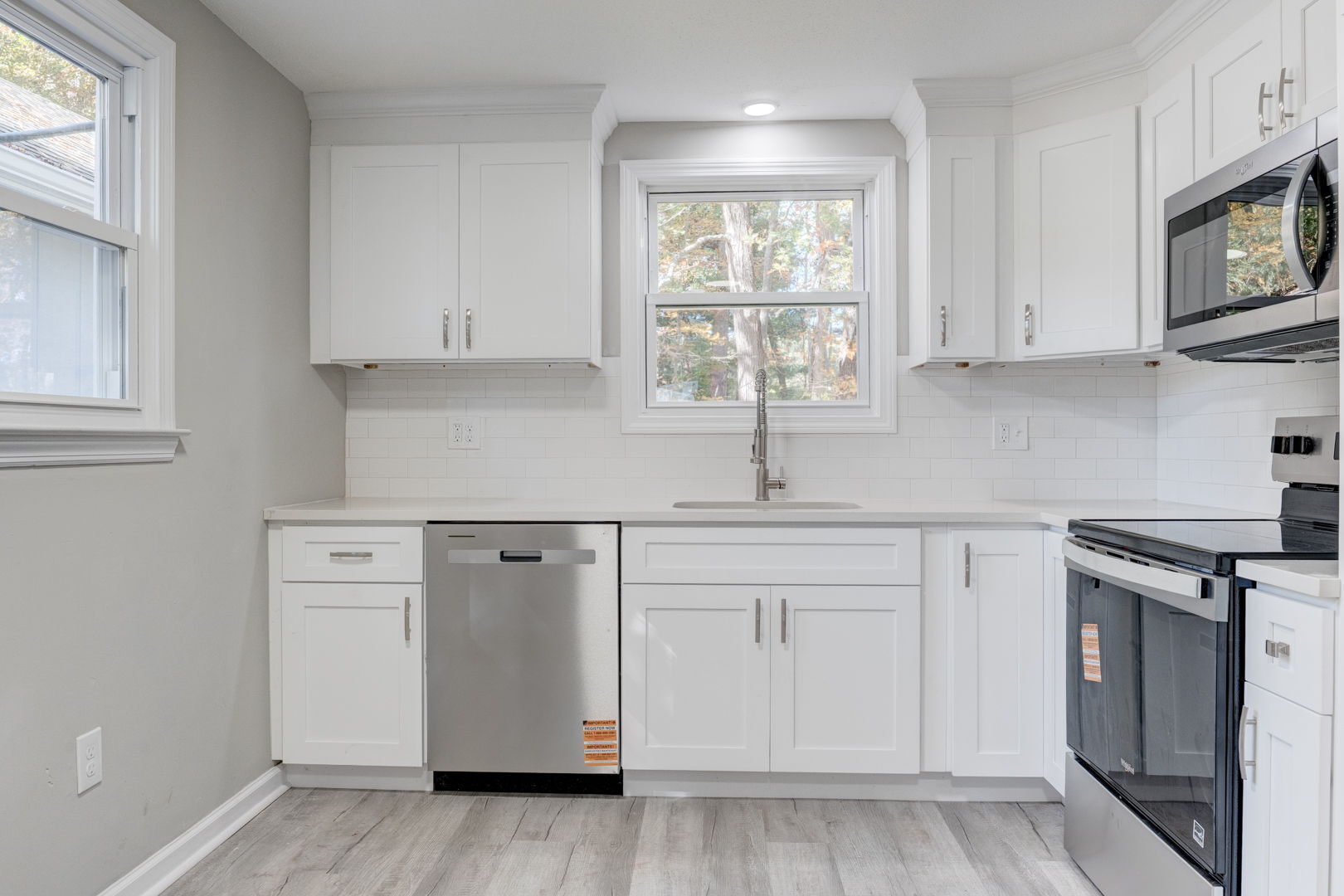 62 Rice Road East Windsor, CT 06016 - Photo 4 of 18 a kitchen with white cabinets and white appliances