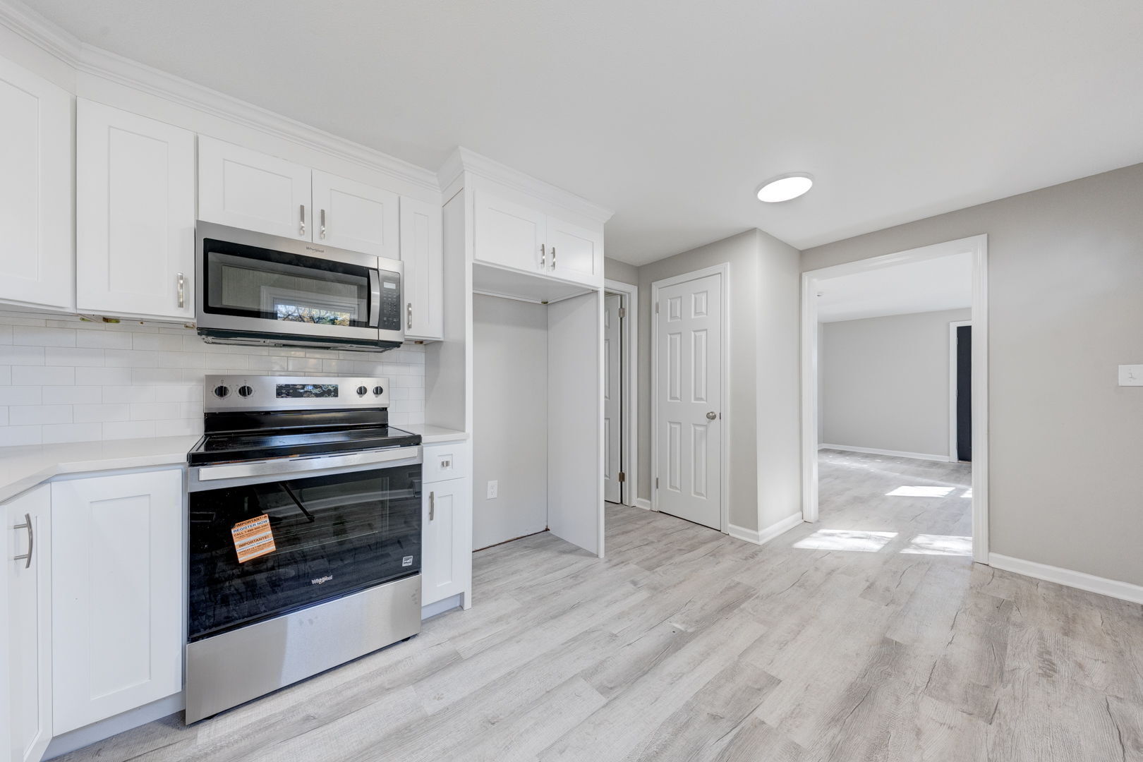 62 Rice Road East Windsor, CT 06016 - Photo 5 of 18 a kitchen with granite countertop a stove a microwave and a hard wood floors
