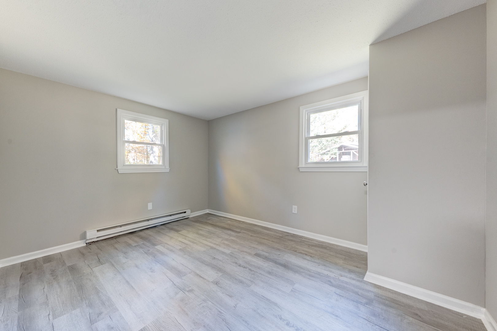 62 Rice Road East Windsor, CT 06016 - Photo 7 of 18 an empty room with wooden floor and windows