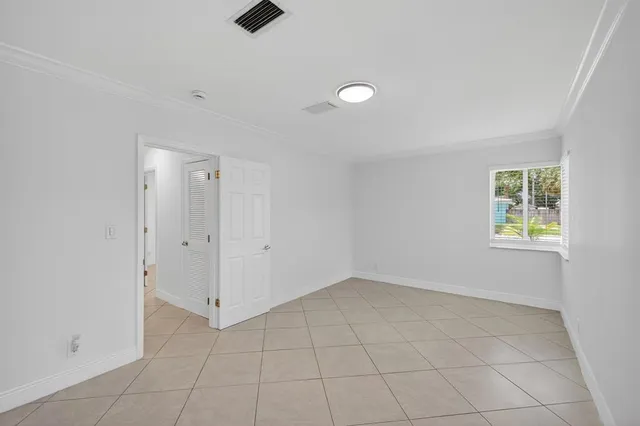 a view of a house with a yard and a garage