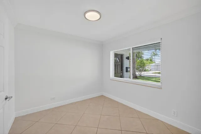 an aerial view of residential houses with outdoor space and street view