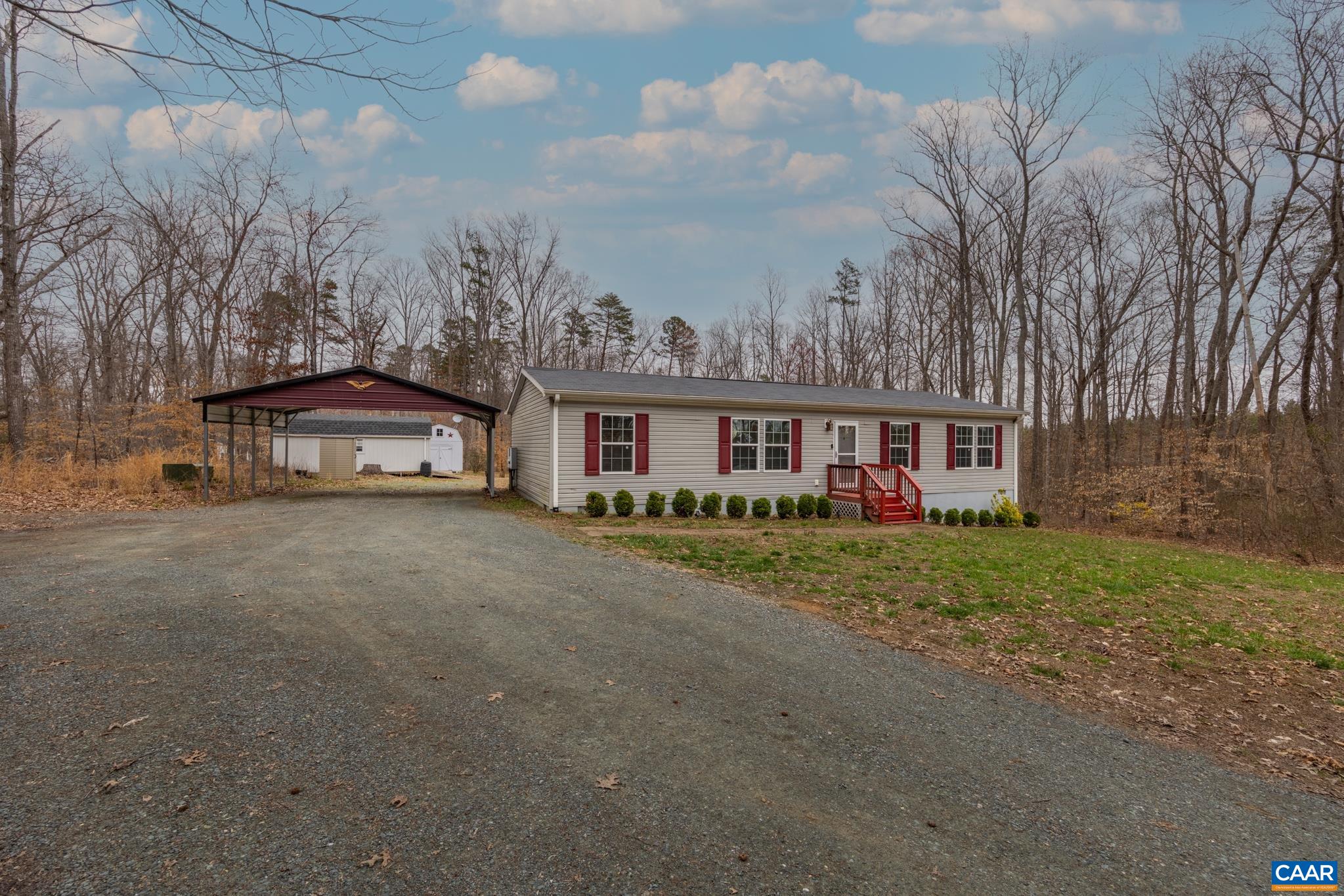 2205 Bybee Road Louisa, VA 23093 - Photo 2 of 28 a view of a house with a yard and large trees