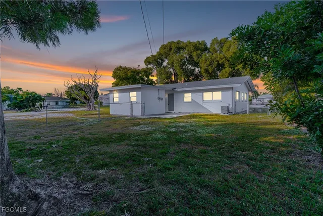 an aerial view of a house with outdoor space