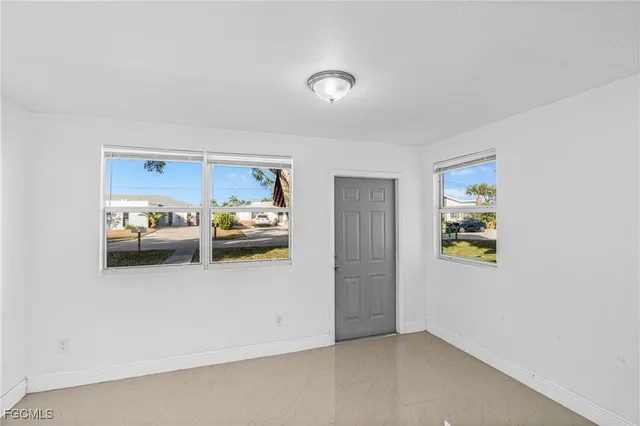 a view of a hallway with wooden shelves