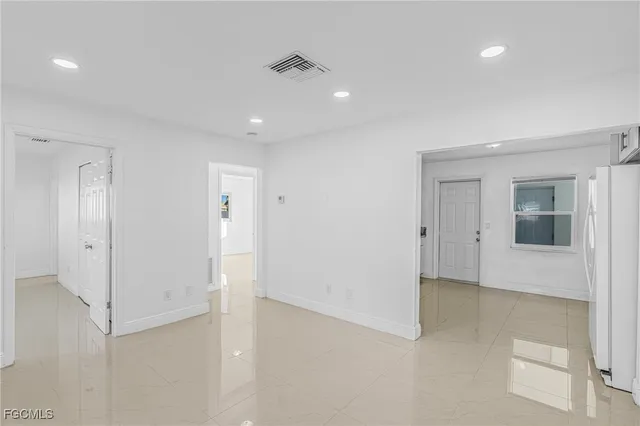 en empty room with an entryway