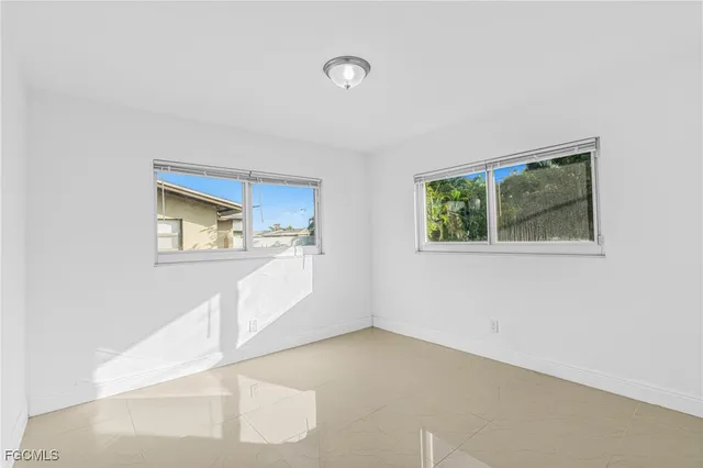 a bathroom with a toilet a sink and a mirror