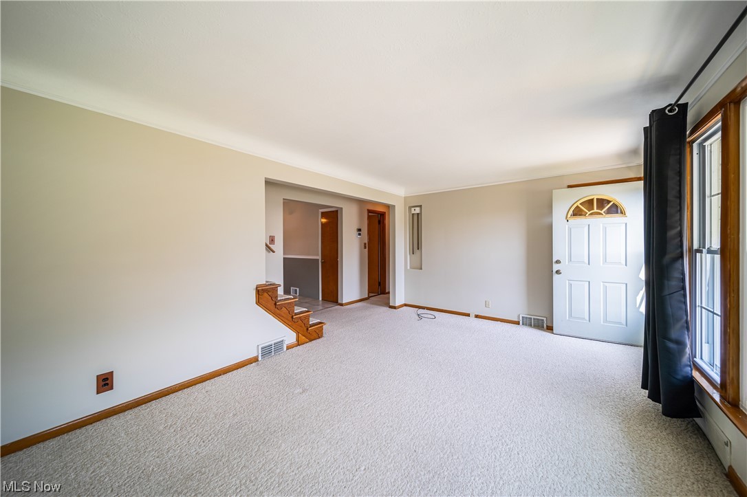 648 Pendley Road Willowick, OH 44095 - Photo 4 of 35 Carpeted living room with crown molding