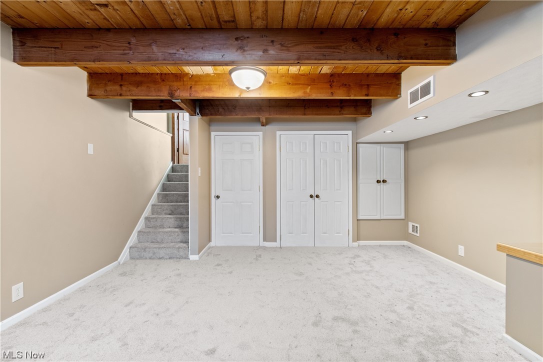 2921 Sanitarium Road Akron, OH 44312 - Photo 25 of 30 Basement featuring light colored carpet and wooden ceiling