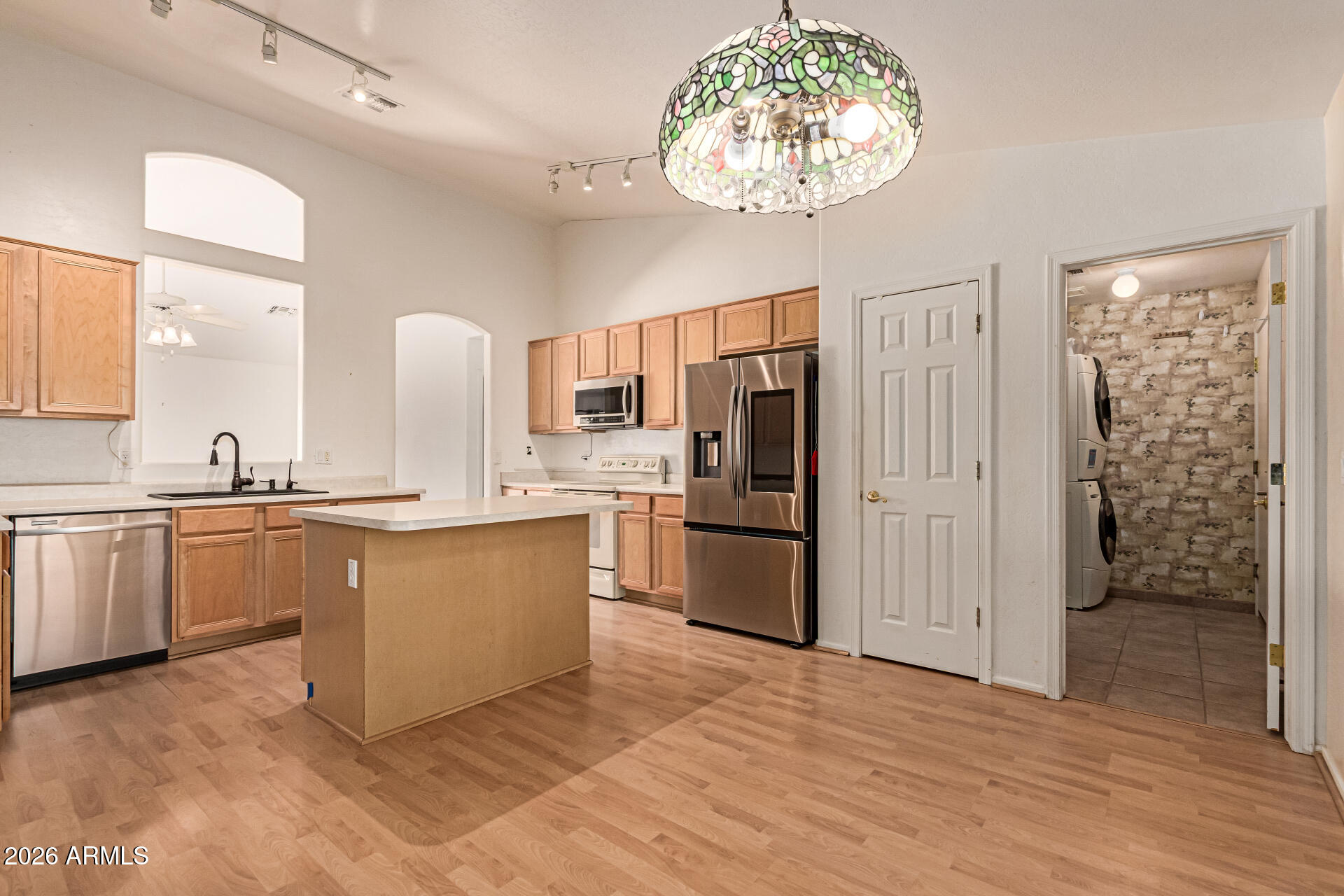 3123 South Del Rancho Mesa, AZ 85212 - Photo 3 of 15 a kitchen with a refrigerator and a sink