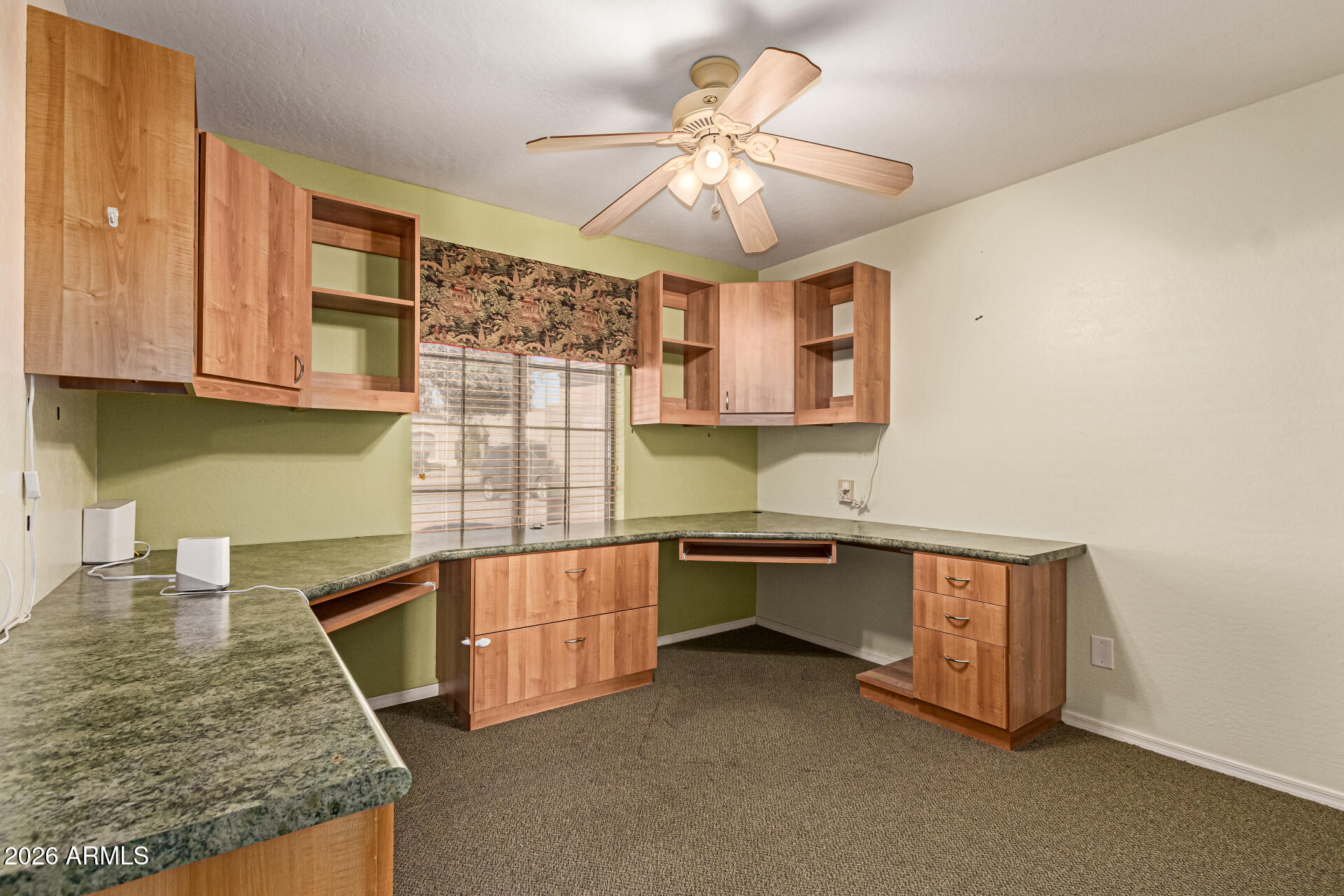 3123 South Del Rancho Mesa, AZ 85212 - Photo 5 of 15 a kitchen with stainless steel appliances granite countertop a sink and cabinets