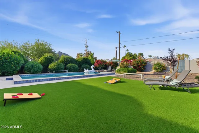 a view of a garden with swimming pool