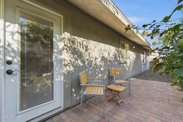 a bench sitting in front of a building
