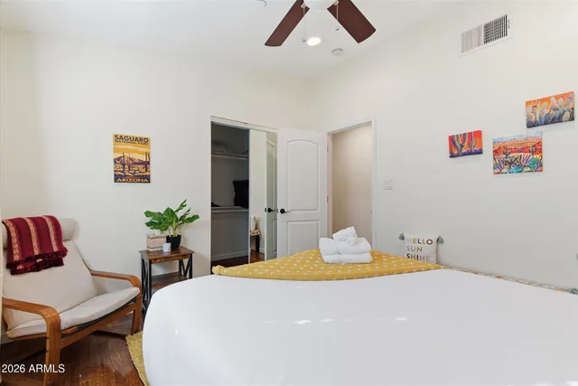 a bedroom with a bed and a table in it