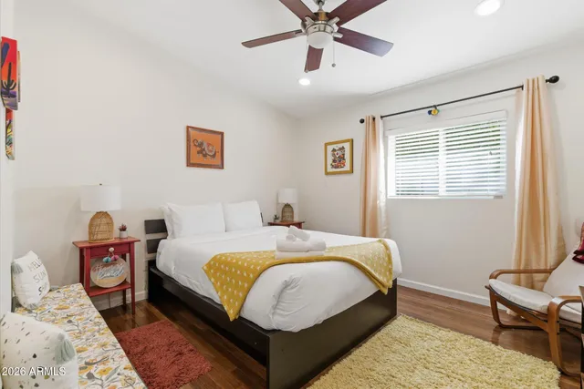 a bedroom with bed and window