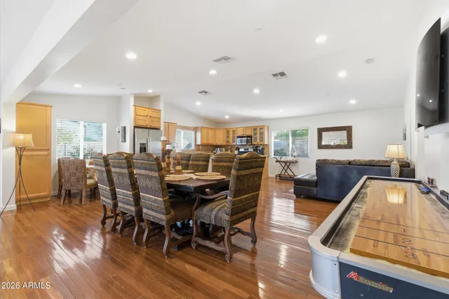 a view of a dining room with furniture window and wooden floor