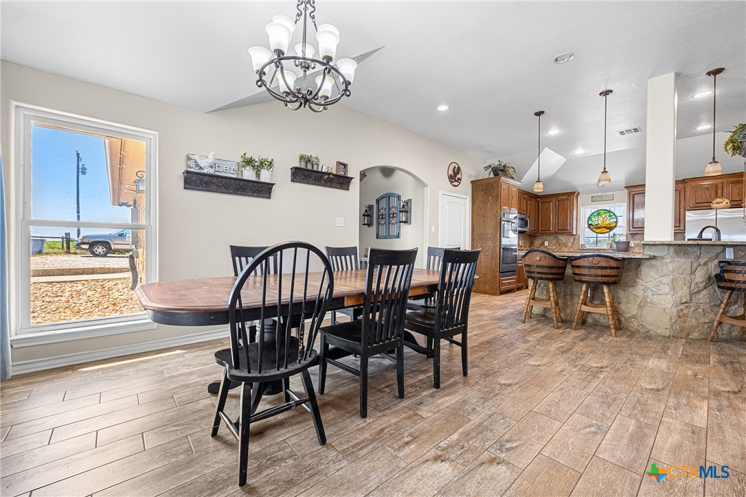 16101 Dove Road Moody, TX 76557 - Photo 14 of 42 a view of a dining room with furniture window and wooden floor