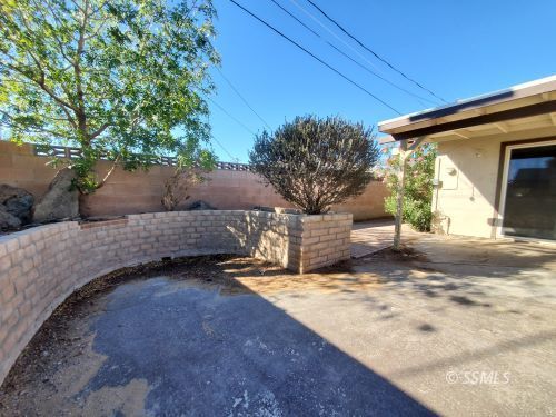 548 South Fairview Street Ridgecrest, CA 93555 - Photo 25 of 35 a view of a house with a yard