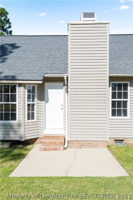 1150 Roundabout Road Cameron, NC 28326 - Photo 20 of 22 a view of a house with a yard and sitting area