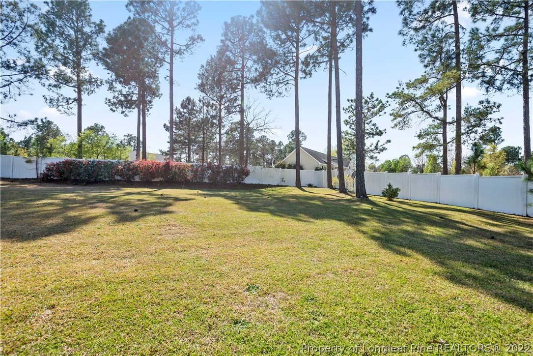 1150 Roundabout Road Cameron, NC 28326 - Photo 22 of 22 a view of a swimming pool with an outdoor space and seating area