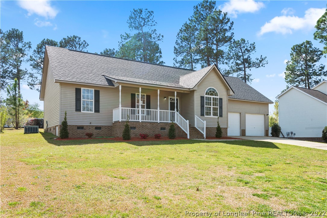 1150 Roundabout Road Cameron, NC 28326 - Photo 3 of 22 a view of a house with a yard