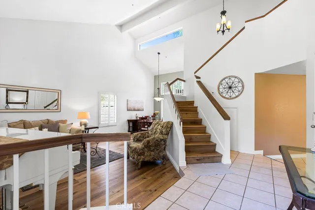 a view of a livingroom with furniture and stairs