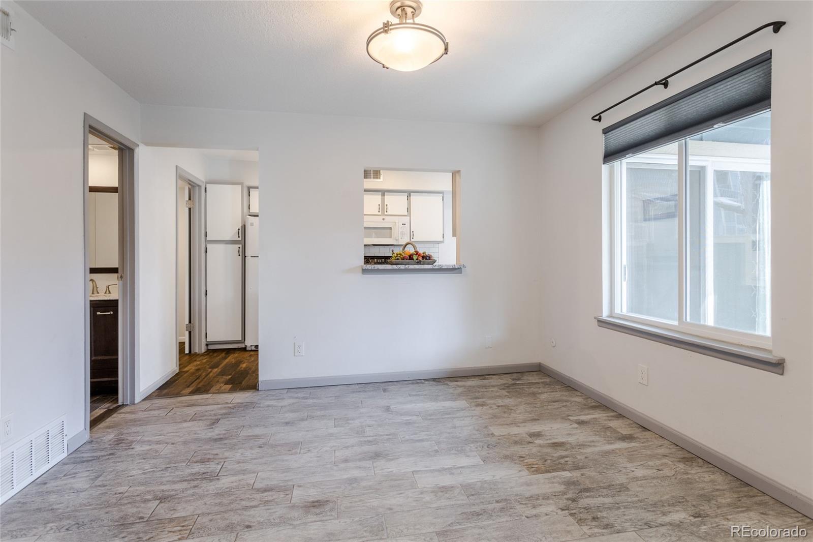 12143 Bannock Street, Unit B Denver, CO 80234 - Photo 12 of 32 an empty room with windows and closet
