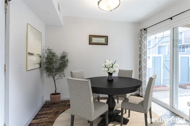 a dining room with furniture and window