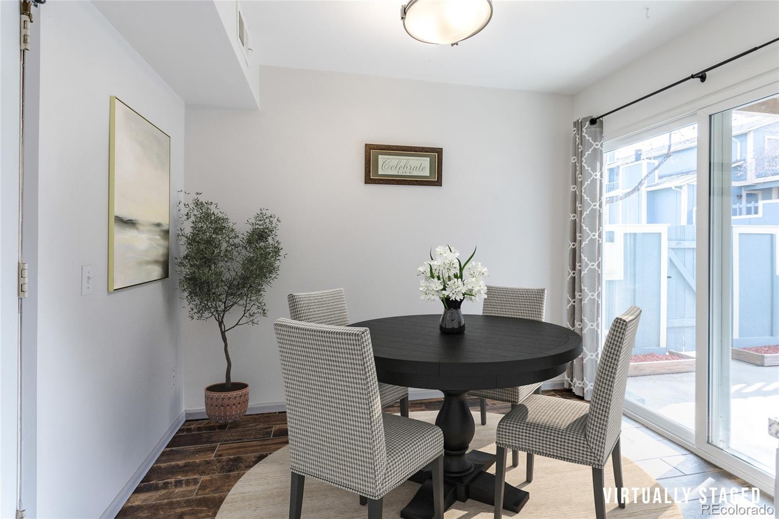 12143 Bannock Street, Unit B Denver, CO 80234 - Photo 15 of 32 a dining room with furniture and window