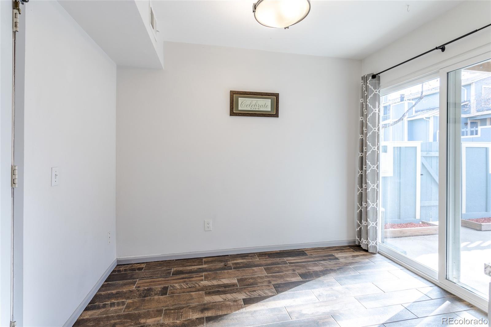 12143 Bannock Street, Unit B Denver, CO 80234 - Photo 16 of 32 a view of an empty room with window
