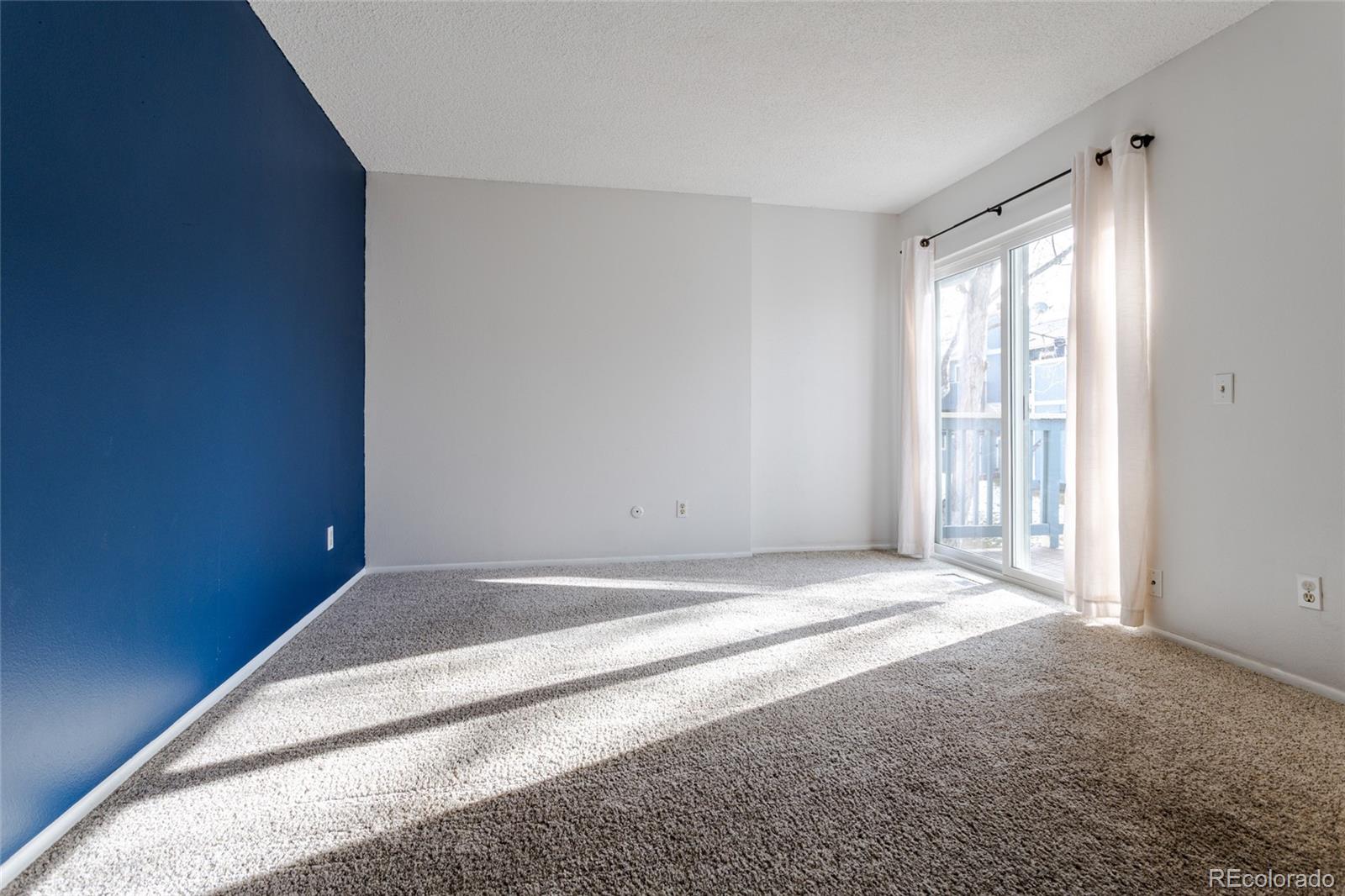 12143 Bannock Street, Unit B Denver, CO 80234 - Photo 18 of 32 a view of an empty room and window