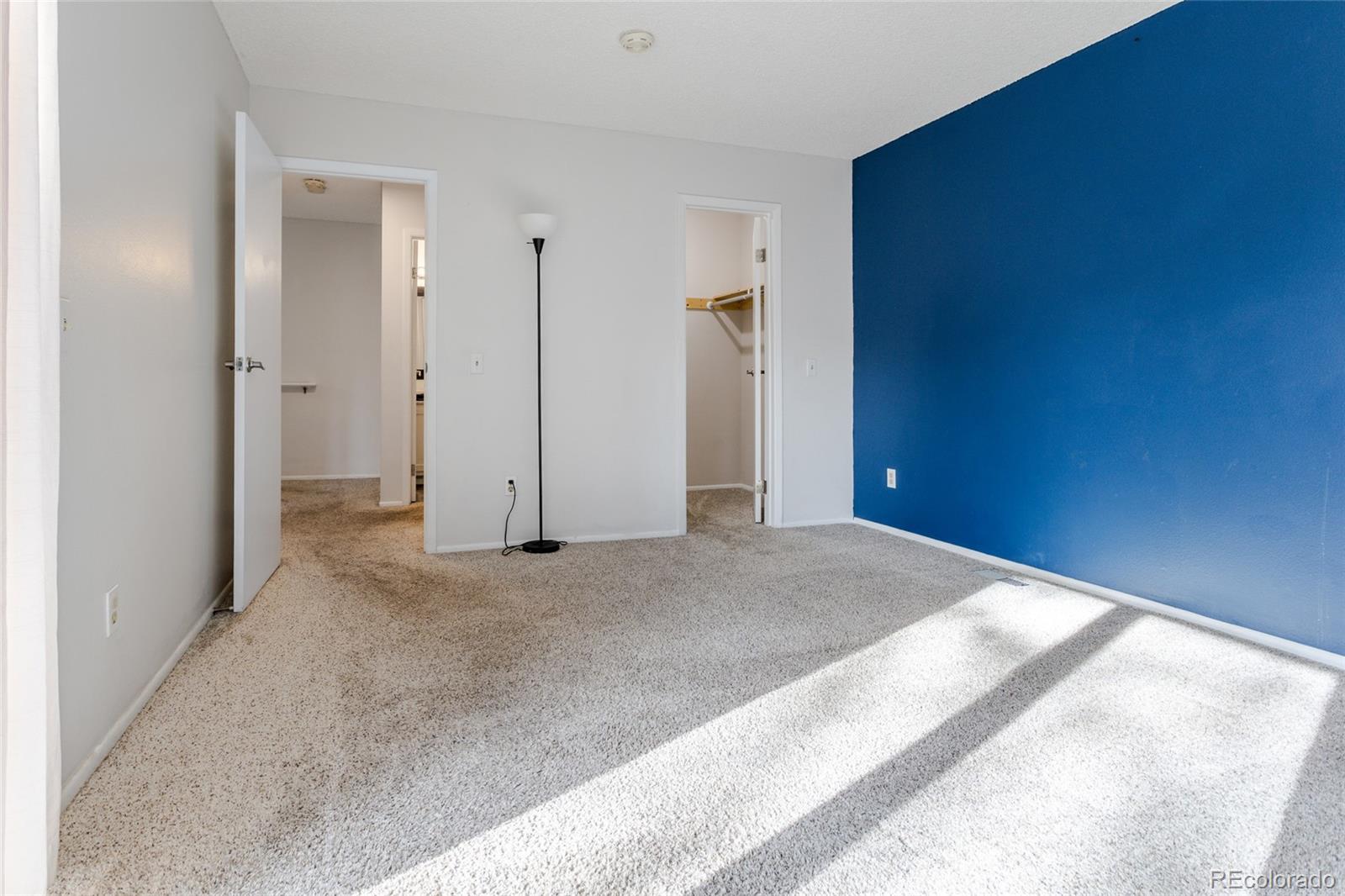 12143 Bannock Street, Unit B Denver, CO 80234 - Photo 19 of 32 an empty room with closet