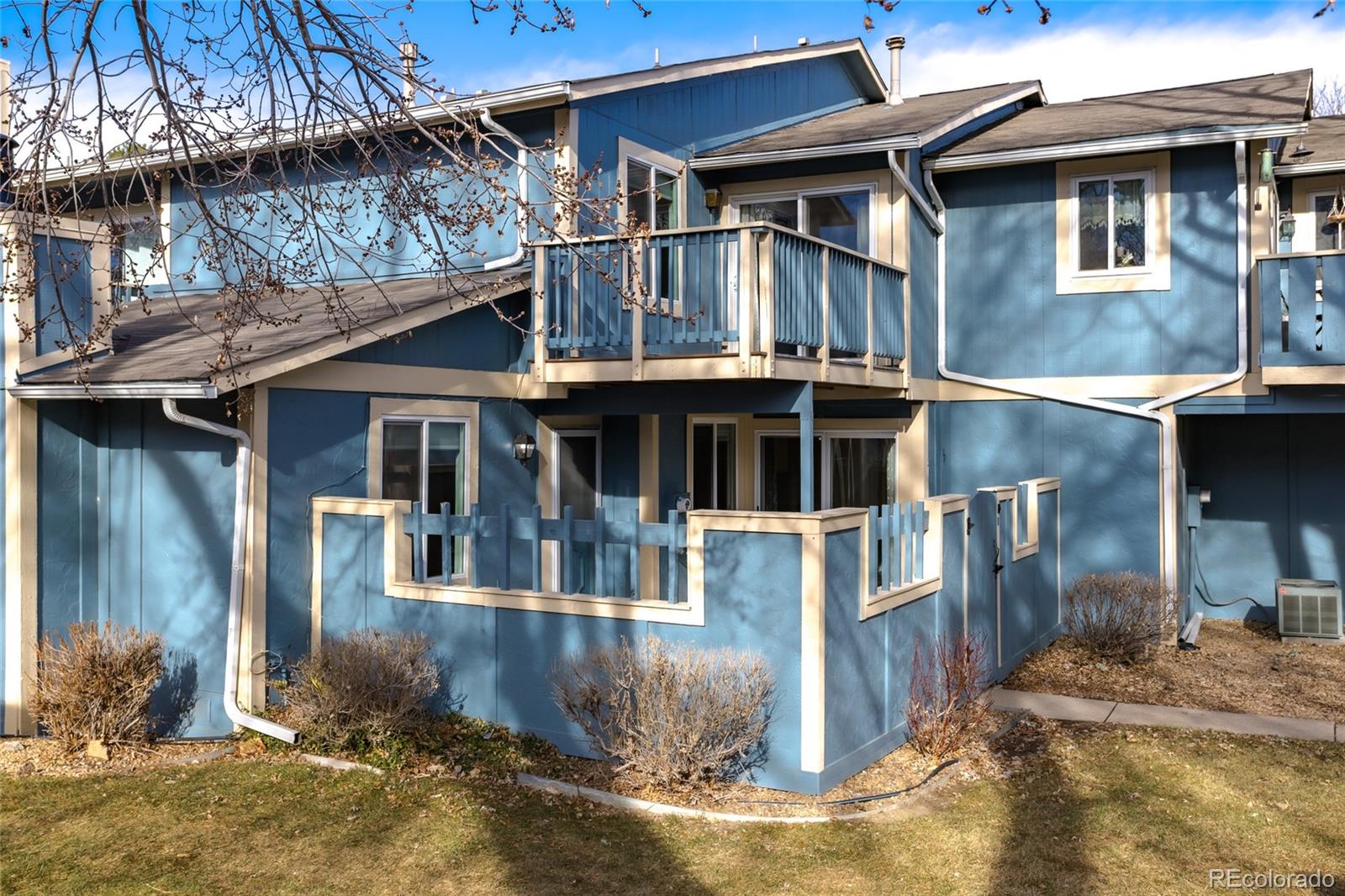 12143 Bannock Street, Unit B Denver, CO 80234 - Photo 2 of 32 a front view of a house with a yard