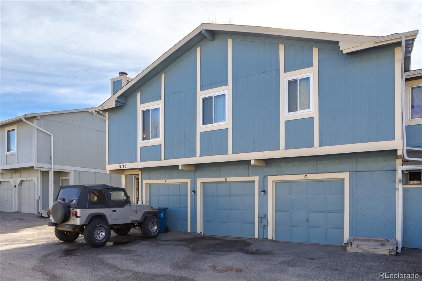 12143 Bannock Street, Unit B Denver, CO 80234 - Photo 28 of 32 a view of a car park in front of house