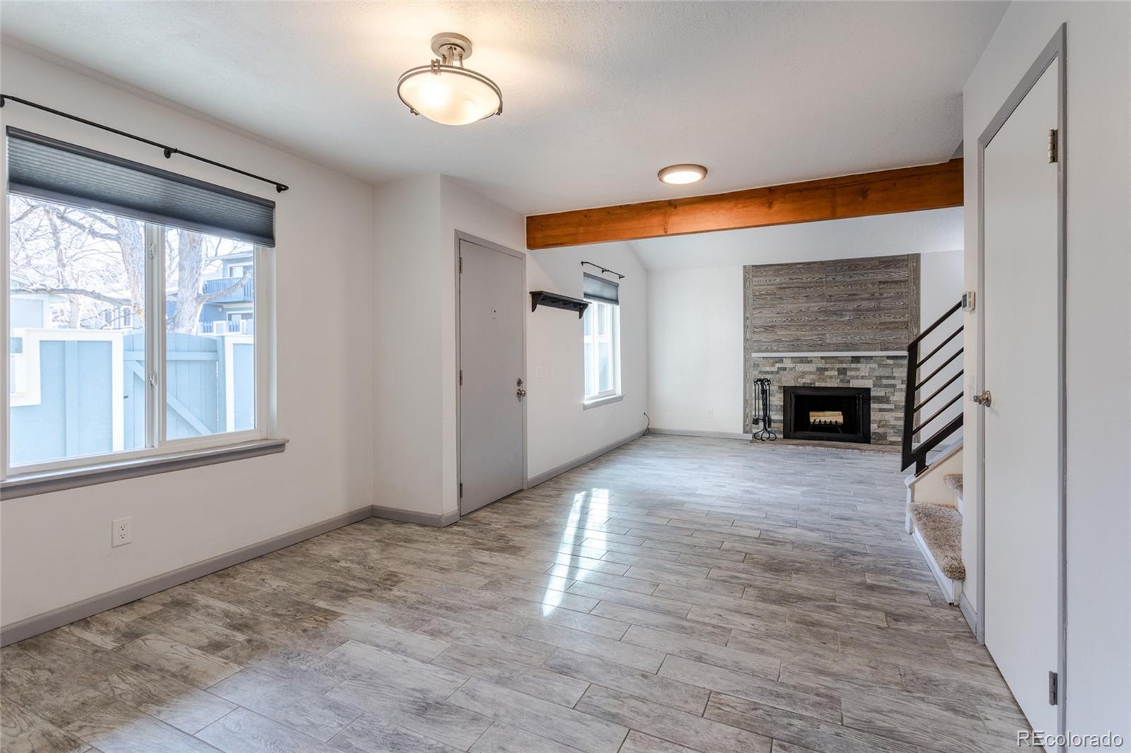 12143 Bannock Street, Unit B Denver, CO 80234 - Photo 9 of 32 a view of livingroom with furniture and fireplace