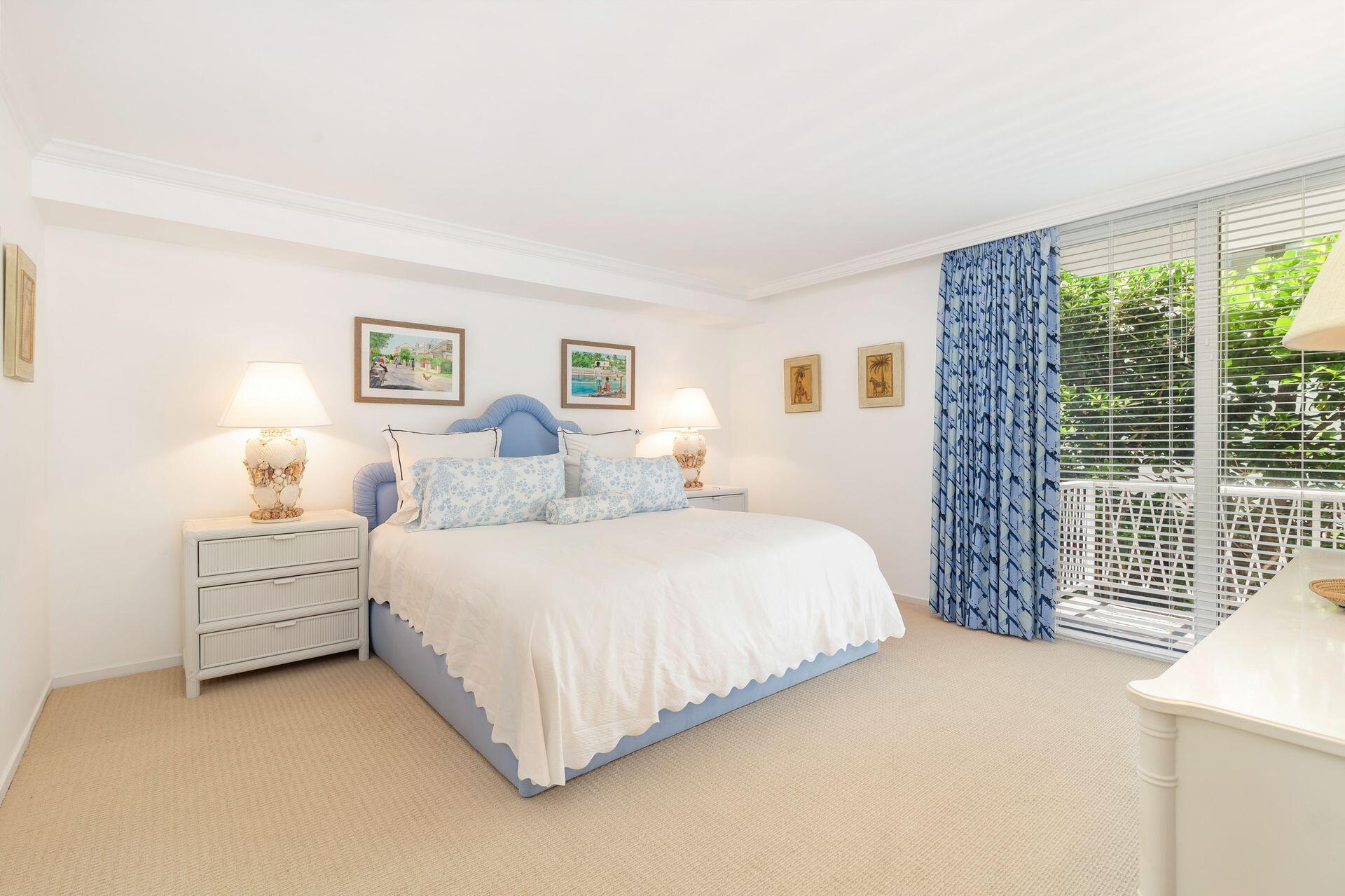 170 Chilean Avenue, Unit 2D Palm Beach, FL 33480 - Photo 13 of 29 a bedroom with bed and a large window