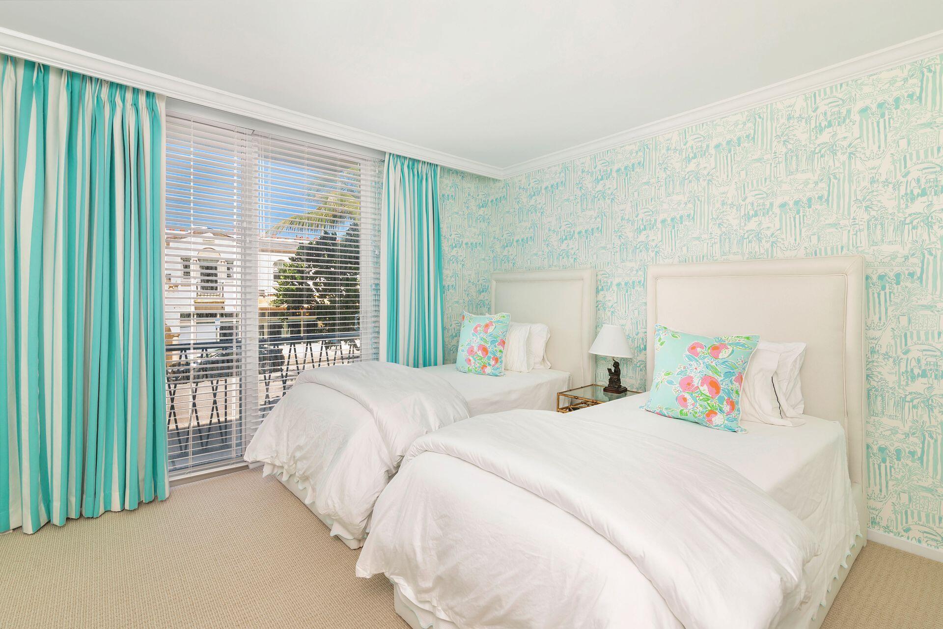 170 Chilean Avenue, Unit 2D Palm Beach, FL 33480 - Photo 17 of 29 a bedroom with a bed and a large window