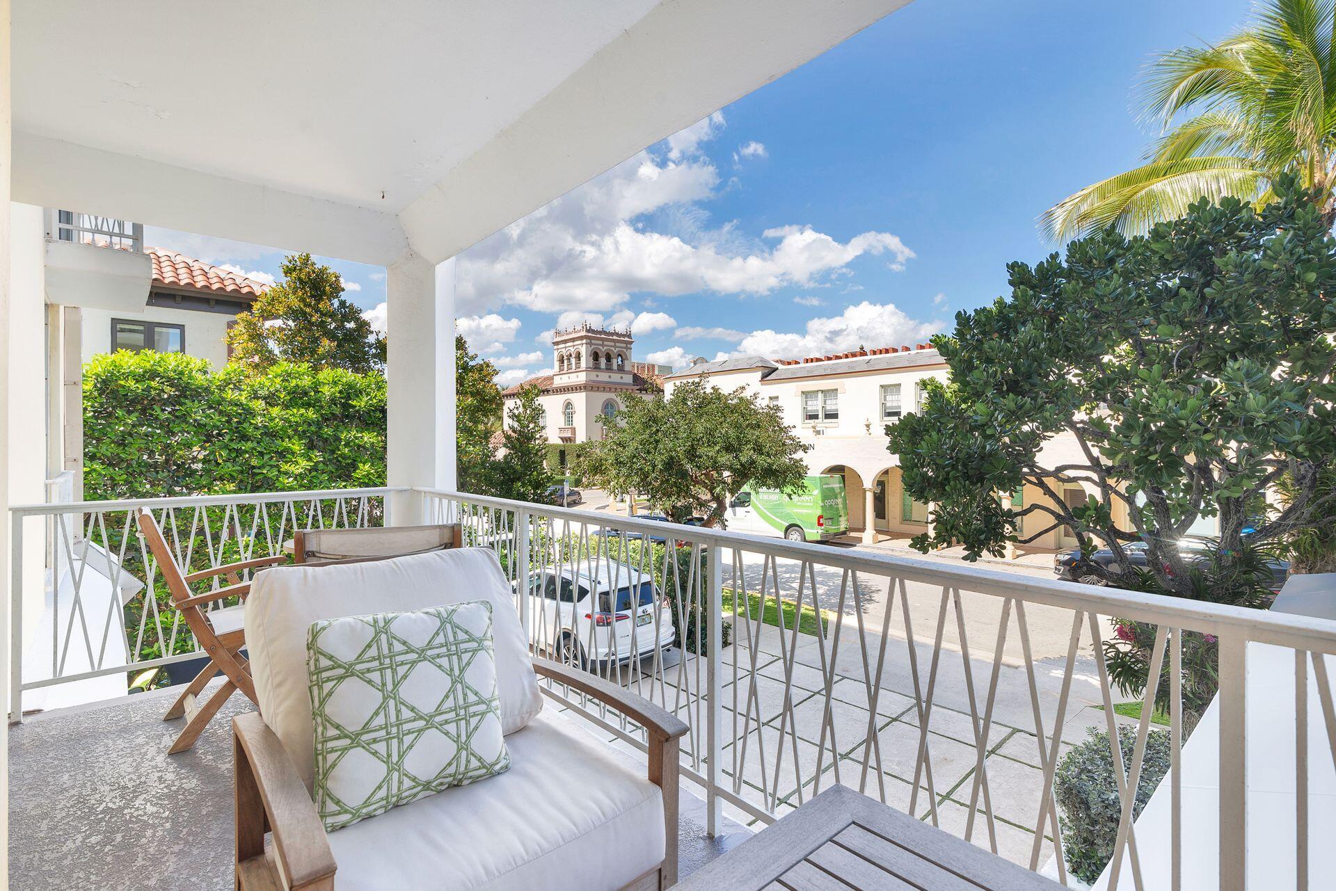 170 Chilean Avenue, Unit 2D Palm Beach, FL 33480 - Photo 19 of 29 a view of a chair and tables in the balcony