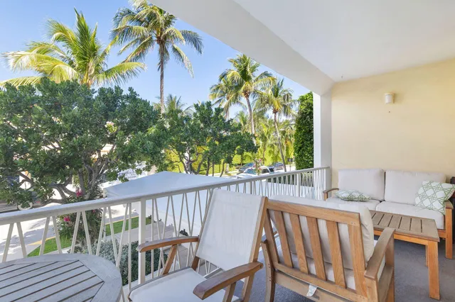 a view of a balcony with furniture