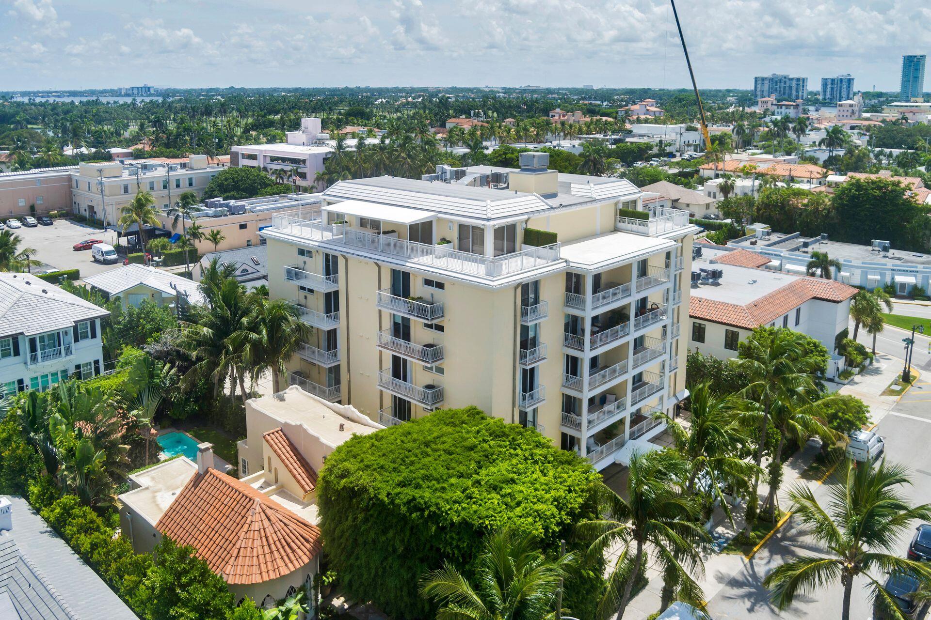 170 Chilean Avenue, Unit 2D Palm Beach, FL 33480 - Photo 24 of 29 a large building with a clock tower in the middle