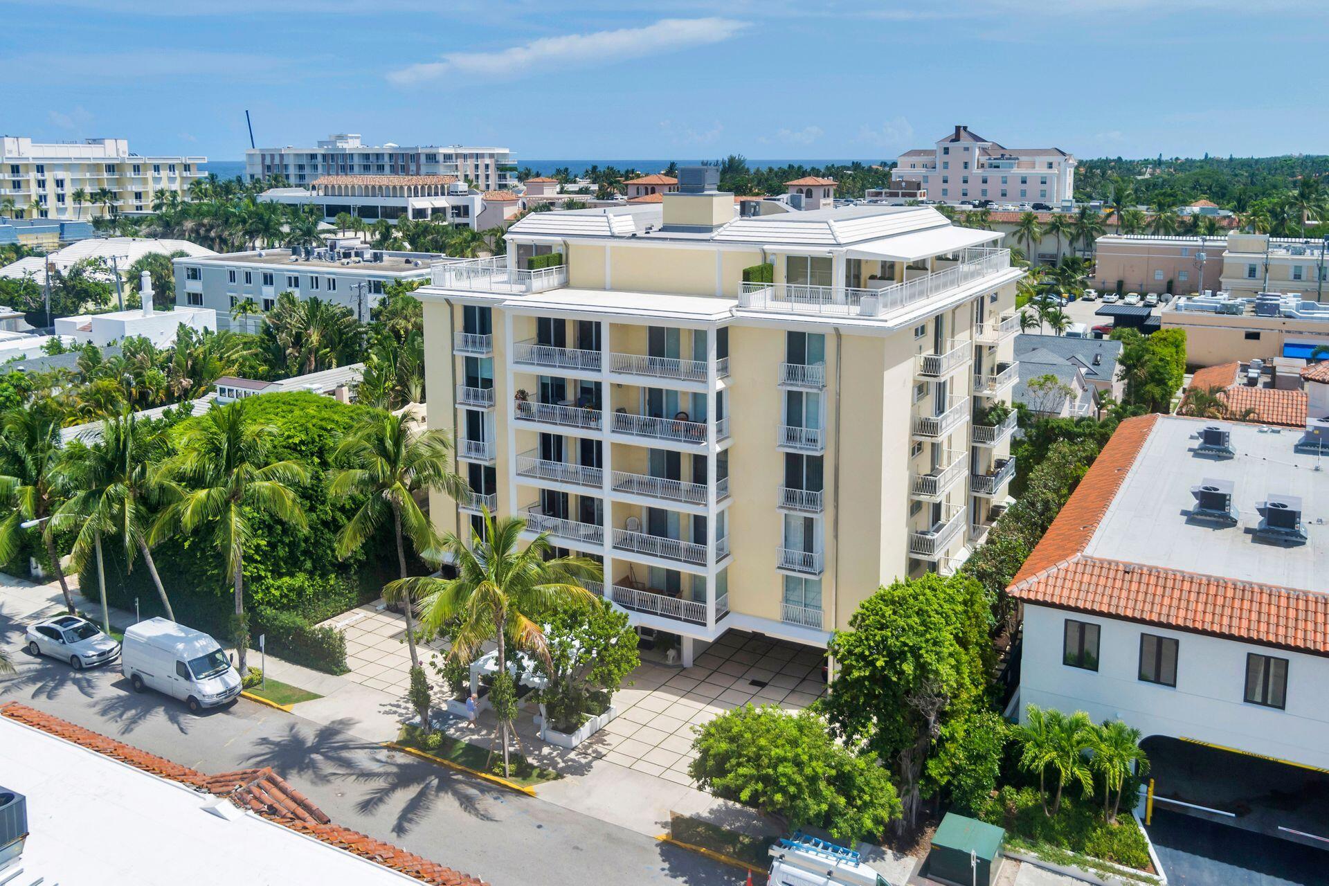 170 Chilean Avenue, Unit 2D Palm Beach, FL 33480 - Photo 26 of 29 a picture of a building with a garden and plants