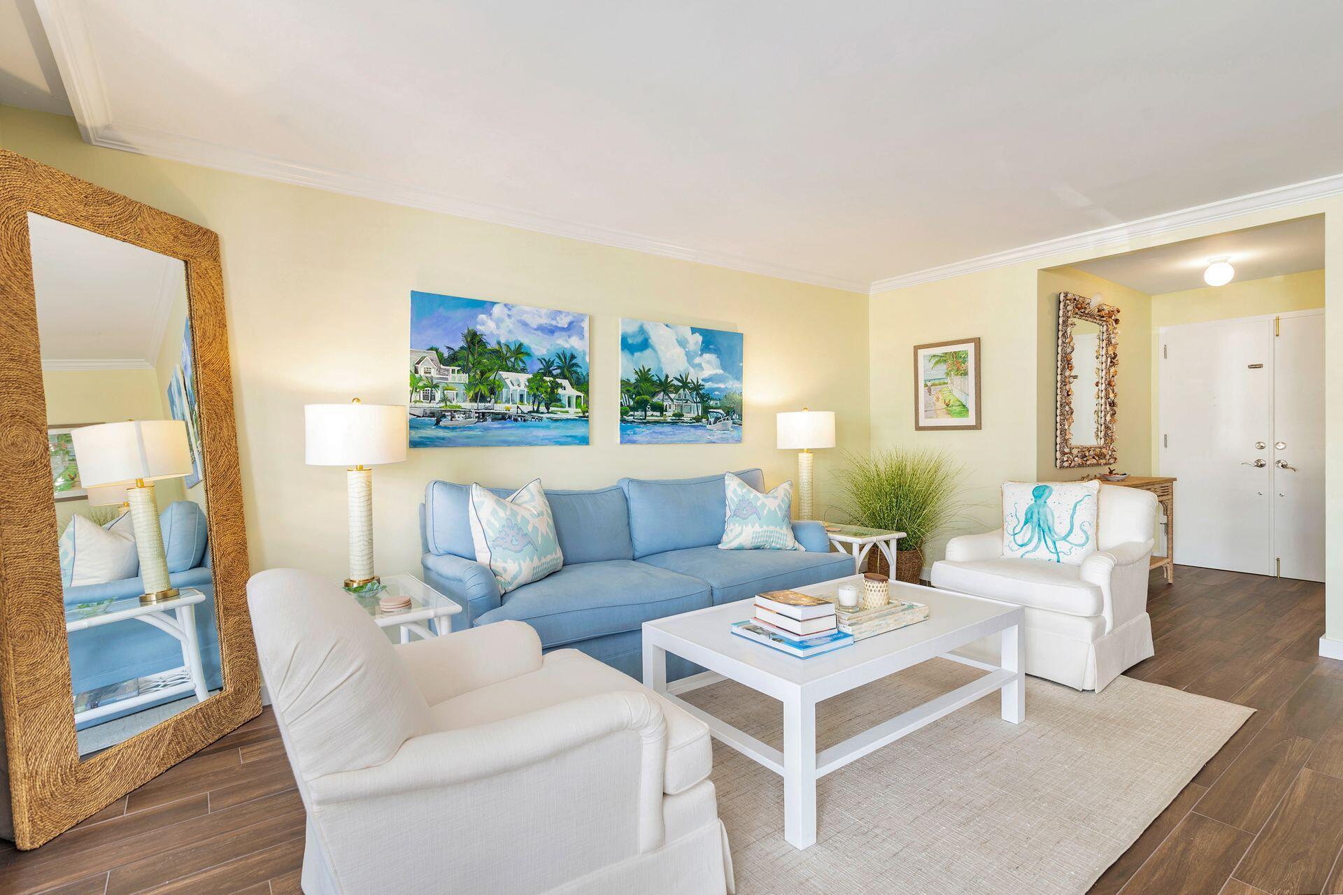 170 Chilean Avenue, Unit 2D Palm Beach, FL 33480 - Photo 5 of 29 a living room with furniture and a large window