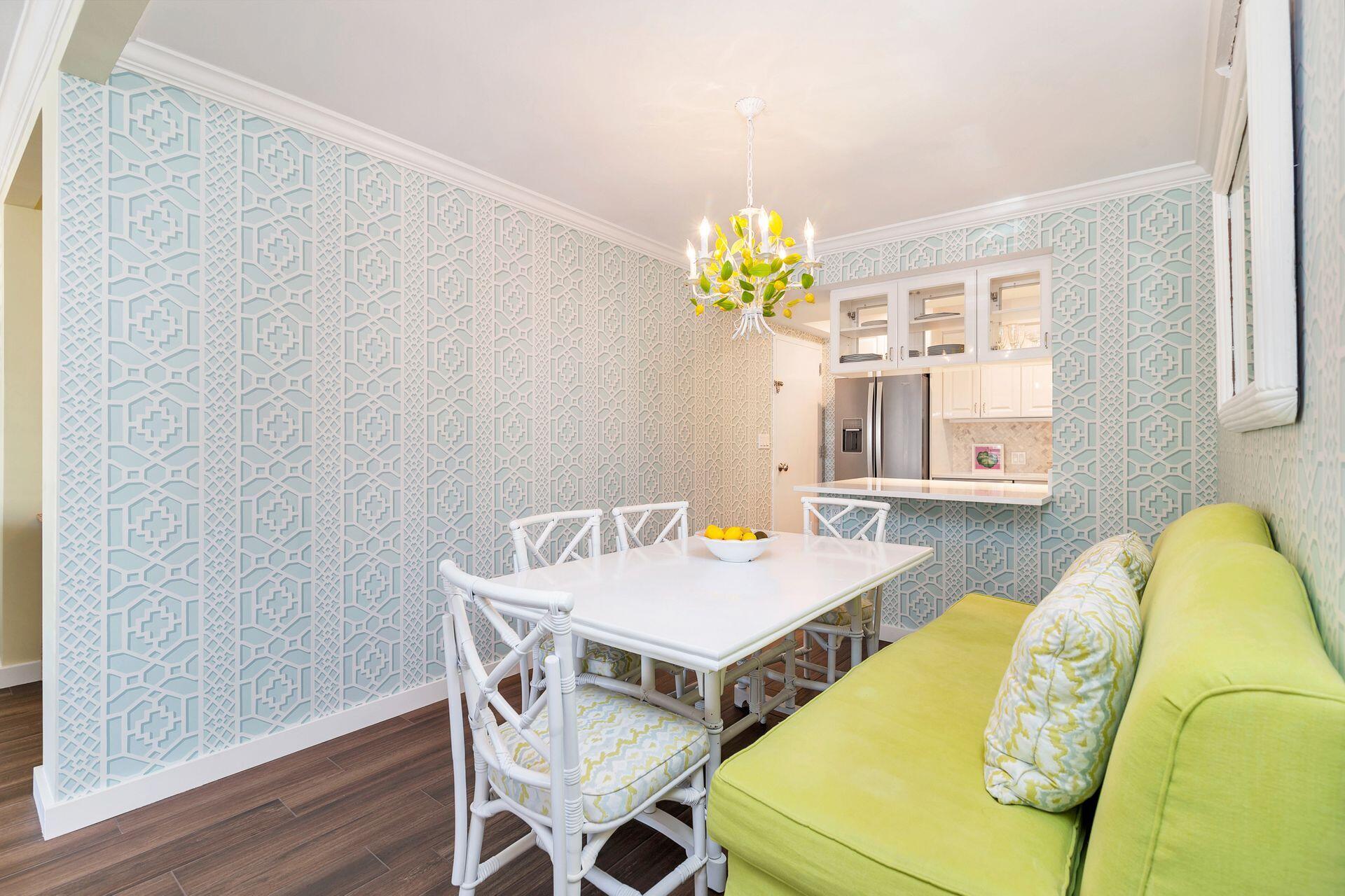 170 Chilean Avenue, Unit 2D Palm Beach, FL 33480 - Photo 8 of 29 a view of a dining room with furniture and a chandelier