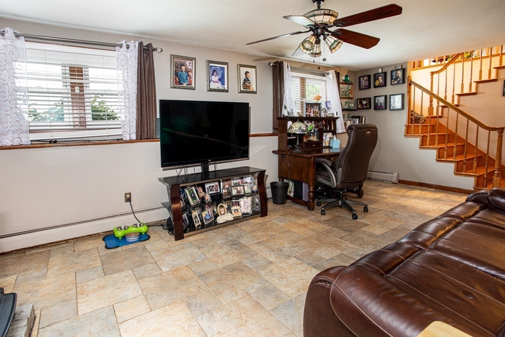 166 Stonehaven Road Fall River, MA 02723 - Photo 25 of 33 a living room with furniture and a flat screen tv