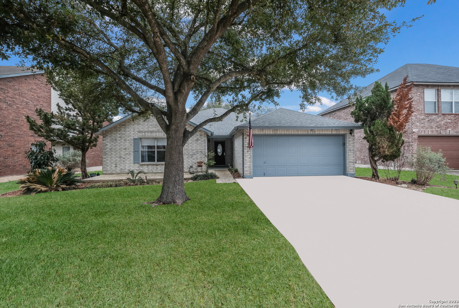 a front view of a house with a yard