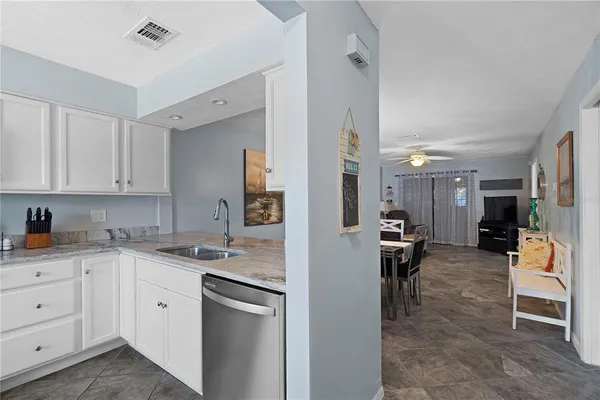 a kitchen with a sink and cabinets