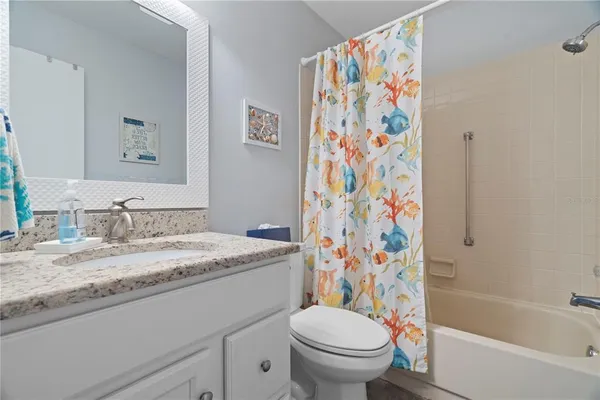 a bathroom with a sink a toilet and a bathtub