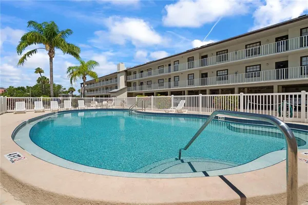 a view of a swimming pool with a garden