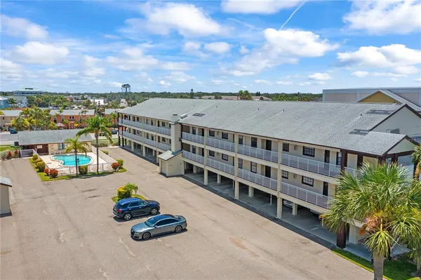 a view of a swimming pool with furniture