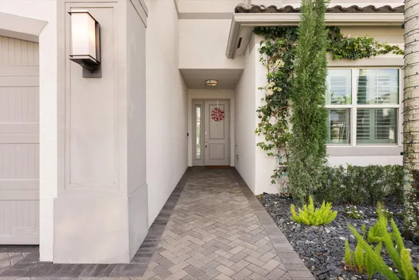 a kitchen with stainless steel appliances kitchen island wooden cabinets and granite counter tops