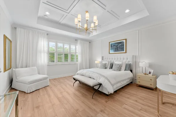 a bedroom with a bed and a desk